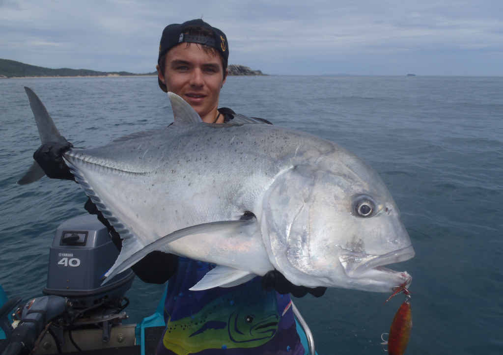 TERRIFIC TREVALLY: Coby Pascoe with a huge giant trevally, photographed then released. TERRIFIC TREVALLY: Coby Pascoe with a huge giant trevally, photographed then released.